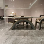Rounded Rectangular Marble Dining Table with Woven Leather Arched Base and Metal Trim